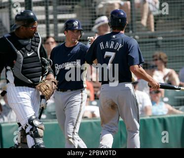 Milwaukee Brewers' J.J. Hardy, right, is congratulated by Prince Fielder  after hitting a two-run home run during the fifth inning of a baseball game  against the Pittsburgh Pirates Friday, July 4, 2008