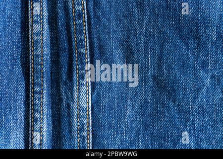 Blue denim with seams and light stains close up Stock Photo