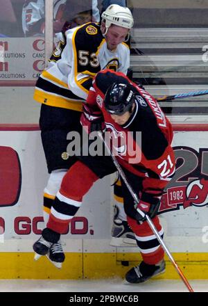 New Jersey Devils' Brad Lukowich (21) checks New York Rangers' Brendan  Shanahan during second period NHL hockey Tuesday night, Feb. 6, 2007 in  East Rutherford, N.J. (AP Photo/Bill Kostroun Stock Photo - Alamy