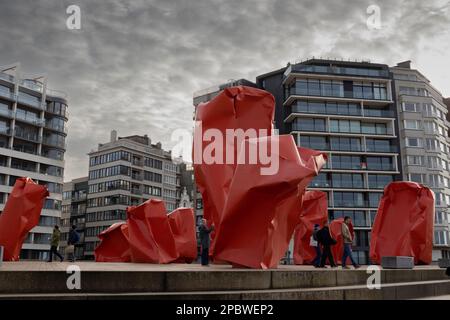 OSTEND, BELGIUM, 3 JANUARY 2023: Public artwork 'Rock Strangers' by Arne Quinze and surrounding buildings on the promenade of Ostend. Ostend is a popu Stock Photo