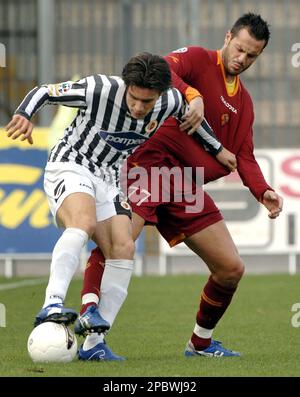 AS Roma s defender Marco Casetti right in action with Ascoli s