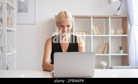 Online work remote job business woman using laptop Stock Photo