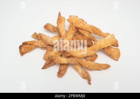 Pile of homemade simple salty bread sticks. Close up studio shot, isolated on white background Stock Photo