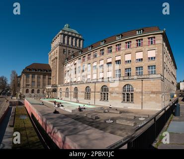 ETH University Zurich, Switzerland. Daytime, blue sky, wide angle view. Students enjoying their break sitting outside. Stock Photo
