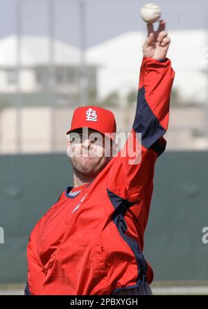 St. Louis Cardinals' outfielder Jim Edmonds played first base Sunday for  the injured Albert Pujols (not pictured). Edmonds calls for a pop up by the  Chicago Cubs' pinch hitter Phil Nevin to