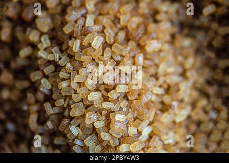 Organic brown textured sugar crystals Stock Photo