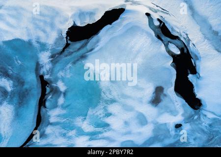 Textured background of frozen water with snow and smooth surface in winter time in Vatnajokull National Park Stock Photo