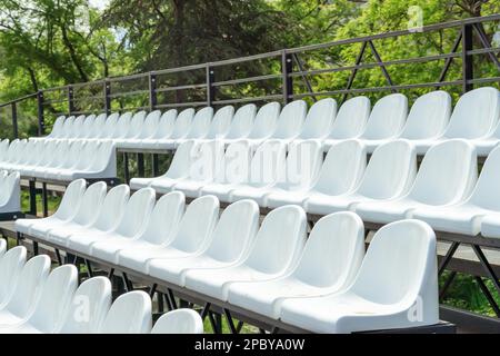 Tribune sports stadium with empty chairs Stock Photo - Alamy