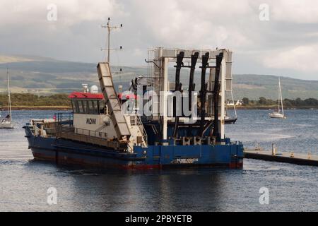 A Mowi salmon fishing vessel at Tobermory, Mull, Scotland just starting out on a shift Stock Photo