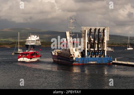 A Mowi salmon fishing vessel at Tobermory, Mull, Scotland just starting out on a shift Stock Photo