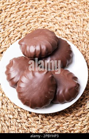 photo of a lot of chocolate-covered marshmallows on a plate Stock Photo