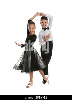 Beautifully dressed couple of kids dancing on white background Stock Photo