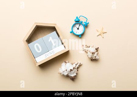 June 1th. Image of june 1 wooden calendar on colored background. Summer day. Empty space for text. Stock Photo