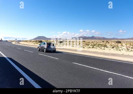 FV-1 road through sand dunes, Parque Natural de Corralejo, Corralejo, Fuerteventura, Canary Islands, Kingdom of Spain Stock Photo