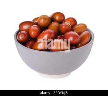 Ripe red dates in bowl on white background Stock Photo