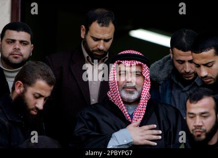 Palestinian Prime Minister Salam Fayyad is surrounded by bodyguards as he  gets out of his car during a visit to the West Bank town of Nablus,  Saturday, Dec. 29, 2007.(AP Photo/Nasser Ishtayeh