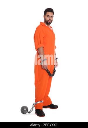 Prisoner in jumpsuit with chained hands and metal ball on white background Stock Photo
