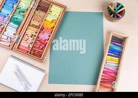 Soft pastels for artists and drawing paper on the wooden table Stock Photo  - Alamy