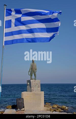 Afanis Naftis (unsung sailor) monument, with Greek flag flying overhead, Vrontados, Island of Chios, Greece Stock Photo