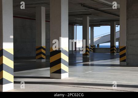 Empty open car parking garage on sunny day Stock Photo