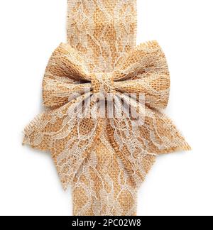Bow and strip of burlap fabric with lace on white background Stock Photo
