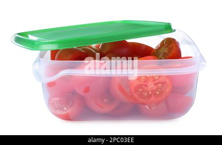 Fresh cut cherry tomatoes in plastic container isolated on white Stock Photo