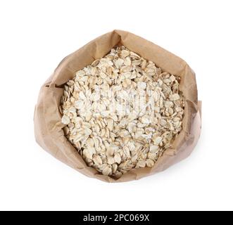 Raw oatmeal in paper bag isolated on white, top view Stock Photo