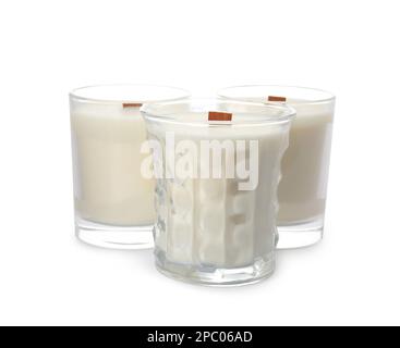 Aromatic soy candles with wooden wicks on white background Stock Photo ...