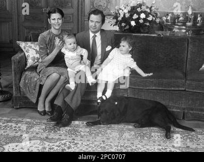 Swedish KING CARL XVI GUSTAF with wife Queen Silvia and the children Carl Philip and Princess Victoria in a sofa at Royal Palace in Stockholm Stock Photo