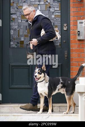 Match Of The Day host Gary Lineker leaves his home in London with his dog, the former footballer, will continue as a BBC presenter after the corporation apologised for a 'difficult period for staff, contributors, presenters, and most importantly, our audiences'. Picture date: Monday March 13, 2023. Stock Photo