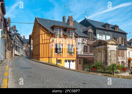 Old cozy street with timber framing houses in Honfleur, Normandy, France. Architecture and landmarks of Honfleur, Normandie Stock Photo