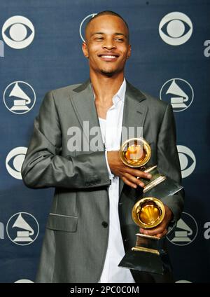ti-poses-with-the-awards-for-