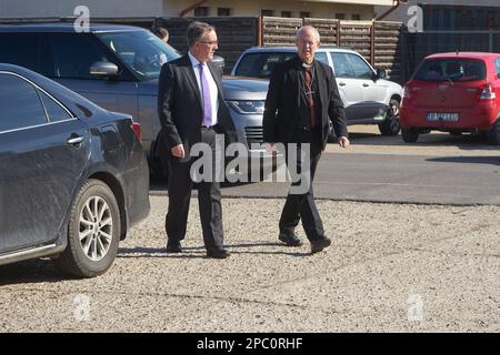 Bucharest, Romania. 13th Mar, 2023: The Most Reverend Justin Welby, Archbishop of Canterbury (R), arrives accompanied by Andrew Noble LVO (L), British Ambassador to Romaniavisit, at the UNHCR integrated center for Ukrainian refugees due to the Russian invasion of Ukraine, at the Romexpo exhibition centre. During the three-day visit in Romania the Archbishop will have several high-level meetings with Her Majesty Margareta, Custodian of the Romanian Crown, the Romanian Patriarch Daniel and politicians. Credit: Lucian Alecu/Alamy Live News Stock Photo