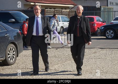 Bucharest, Romania. 13th Mar, 2023: The Most Reverend Justin Welby, Archbishop of Canterbury (R), arrives accompanied by Andrew Noble LVO (L), British Ambassador to Romaniavisit, at the UNHCR integrated center for Ukrainian refugees due to the Russian invasion of Ukraine, at the Romexpo exhibition centre. During the three-day visit in Romania the Archbishop will have several high-level meetings with Her Majesty Margareta, Custodian of the Romanian Crown, the Romanian Patriarch Daniel and politicians. Credit: Lucian Alecu/Alamy Live News Stock Photo