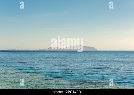 Amazing view of Red sea surface and Tiran Island. Egypt, Sharm El Sheikh. Tourism and travel. Stock Photo
