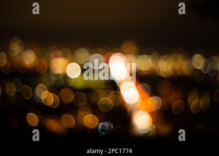 Abstract bokeh balls of highlights created by car traffic lights at night. Stock Photo