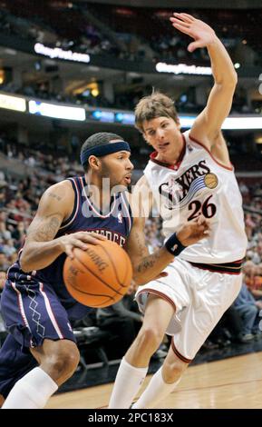 New Jersey Nets Eddie House left is guarded by Philadelphia 76ers Kyle Korver during the second half of their NBA basketball game on Monday Feb. 5 2007 in Philadelphia. The Sixers won 100 98 in overti...