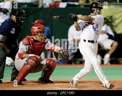 Puerto Rico's catcher Yadier Molina (4) chases down Japan's