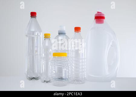 Variety of empty transparent plastic bottles without a label, ready to be recycled. Close up studio shot, no people Stock Photo