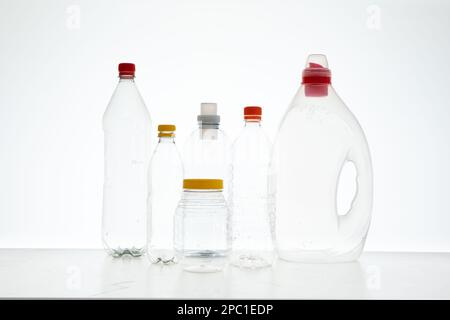 Variety of empty transparent plastic bottles without a label, ready to be recycled. Close up studio shot, no people Stock Photo