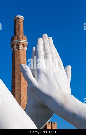 part of Building Bridges sculpture by artist Lorenzo Quinn depicting pairs of monumental hands at Venice, Italy Stock Photo