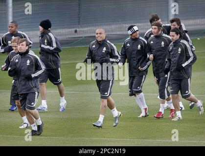 Real Madrid s Ronaldo center smiles as he runs with his