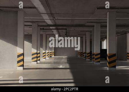 Empty open car parking garage on sunny day Stock Photo