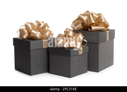 Black gift boxes with golden bows on white background Stock Photo