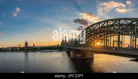 Cologne (Köln) Germany, sunset panorama city skyline at Cologne Cathedral (Cologne Dom) with Rhine River and Hohenzollern Bridge Stock Photo