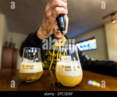 The beer powder from the Neuzelle monastery brewery could revolutionize the beer market. The powder will one day contain all the components for a beer. The traditional brewing process is eliminated. Stephan Fritsche, managing director of the German Klosterbrauerei Neuzelle (monastery brewery) demonstrates the novel beer powder under development Stock Photo