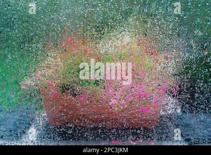 Abstract flower colors photographed through a rainy screen window Stock Photo