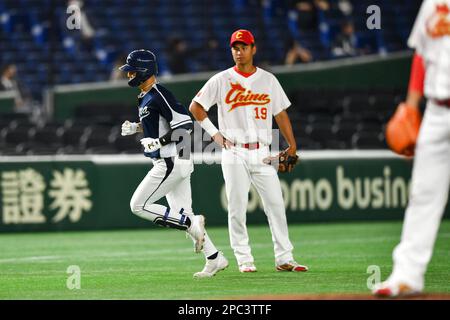 South Korea's Hyeseong Kim runs to first after hitting a game