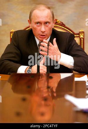 Russian President Vladimir Putin gestures speaking at a meeting of his Cabinet in the Kremlin in Moscow, Tuesday, Jan. 9, 2007. President Vladimir Putin also ordered his Cabinet on Tuesday to consider a possible reduction in oil output amid the ongoing dispute with Belarus, another indication the standoff could drag on. (AP Photo/Natalia Kolesnikova, Pool)