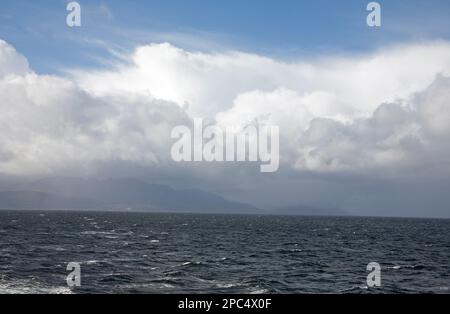 Cloud passing over Goat Fell as viewed from the ferry Caledonian Isles travelling between Brodick and Ardrossan the Isle of Arran Scotland Stock Photo